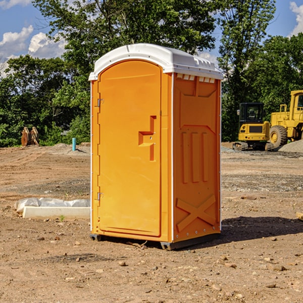 what is the cost difference between standard and deluxe portable restroom rentals in Brookston